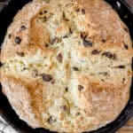 overhead photo of Irish soda bread in a cast iron skillet.