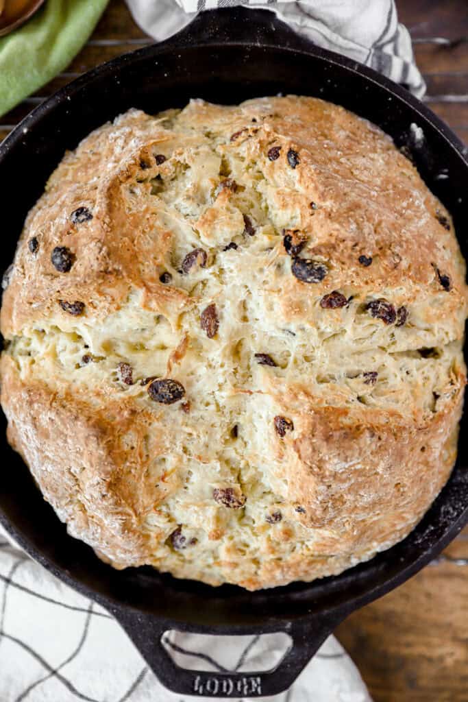 overhead photo of Irish soda bread in a cast iron skillet.