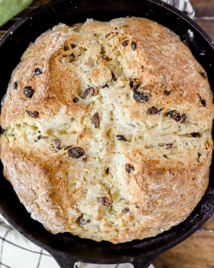 overhead photo of Irish soda bread in a cast iron skillet.