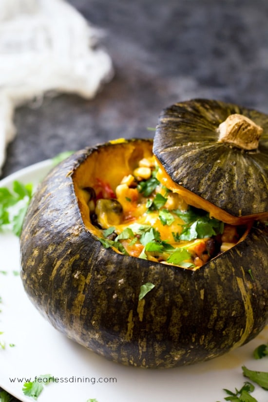 stuffed squash on a white round plate.