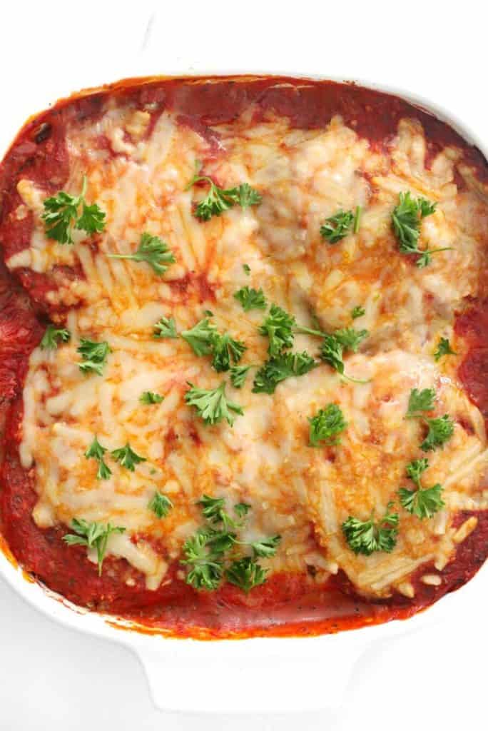 overhead shot of eggplant parm with parsley.