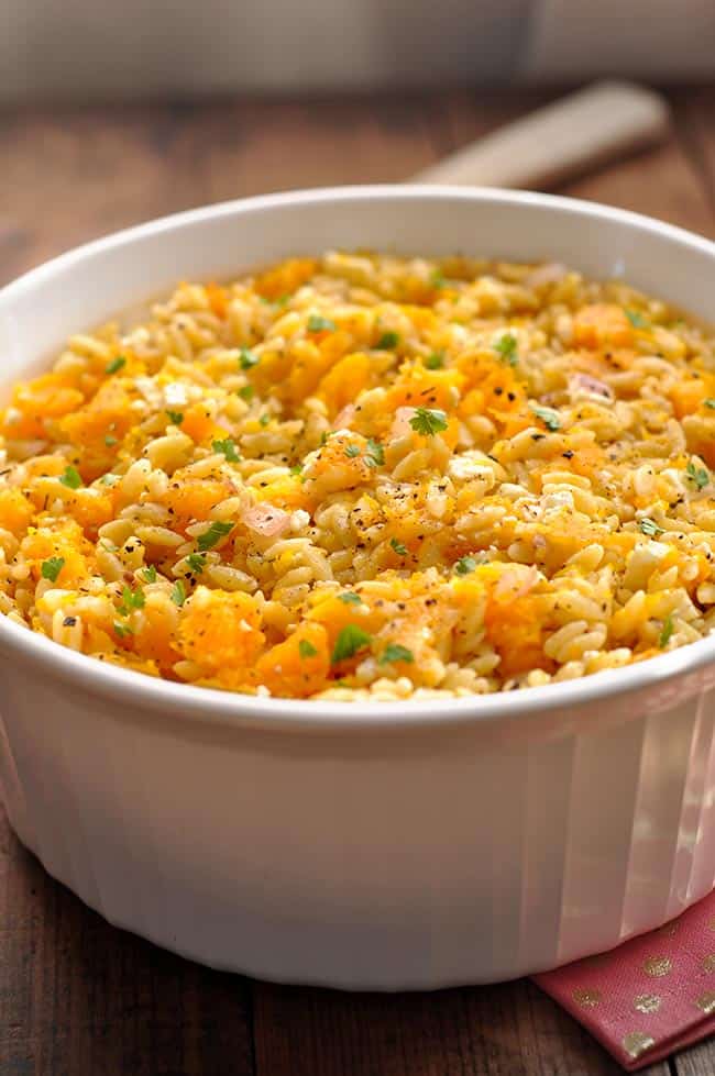 butternut squash and orzo in a white casserole dish