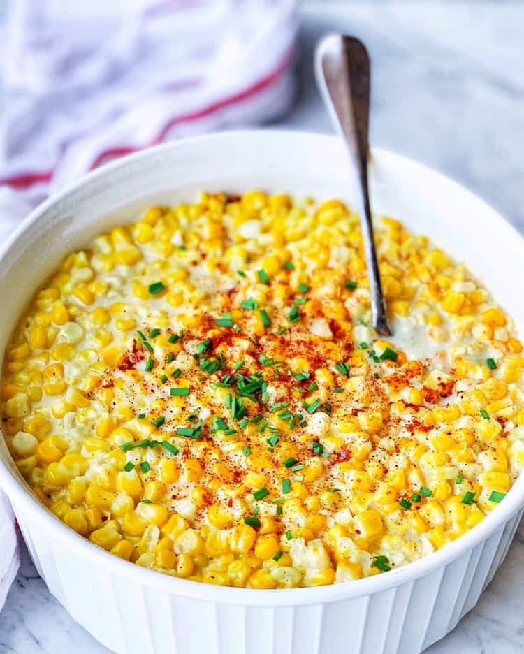 white casserole dish of creamed corn.