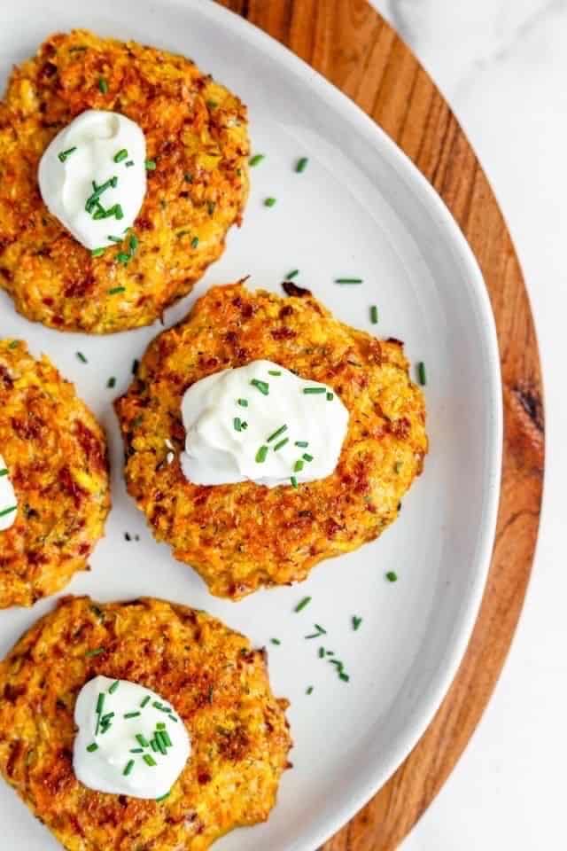 overhead shot of carrot fritters with chives.