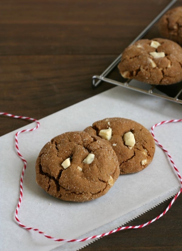 cookies on parchment paper with red and white bakery string.