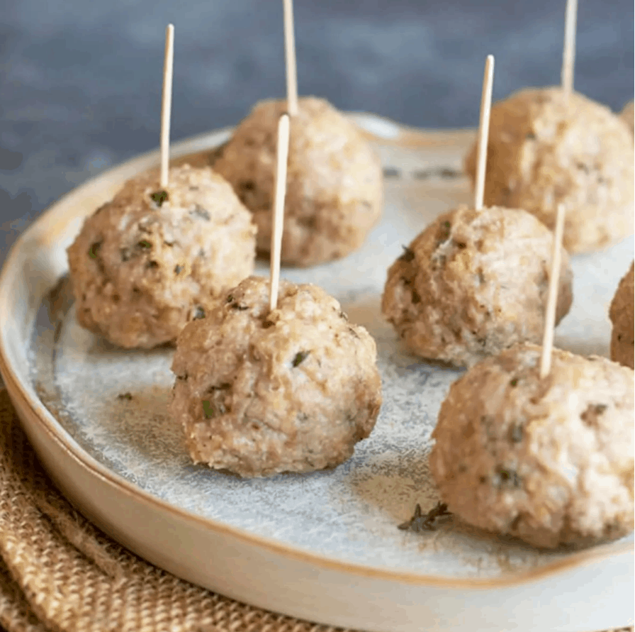 gluten free chicken meatballs with toothpicks in them.