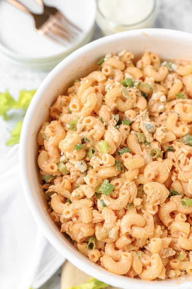 overhead shot of buffalo chicken pasta salad in a white bowl