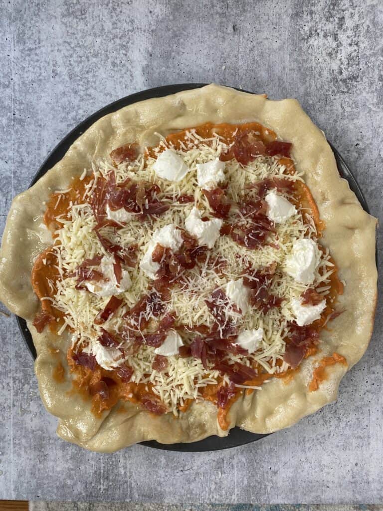 overhead shot of the vodka sauce pizza before baking