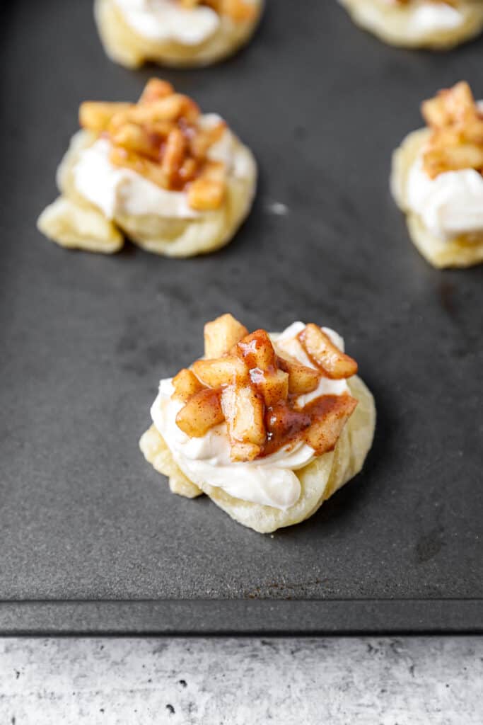 the danishes filled with the cream cheese and apples before baking. 