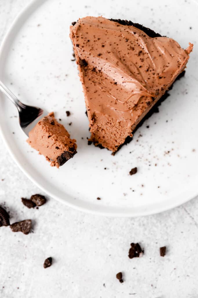 over head shot of a slice of the no bake chocolate cheesecake with a fork.