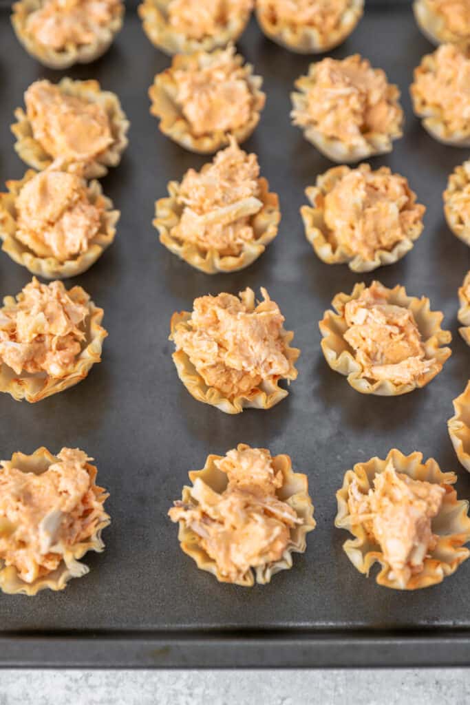 the filled phyllo cups on the baking sheet before baking them.