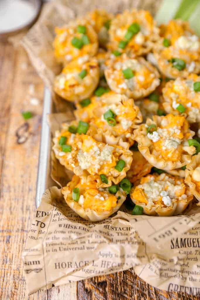 buffalo chicken bites on brown newsprint paper