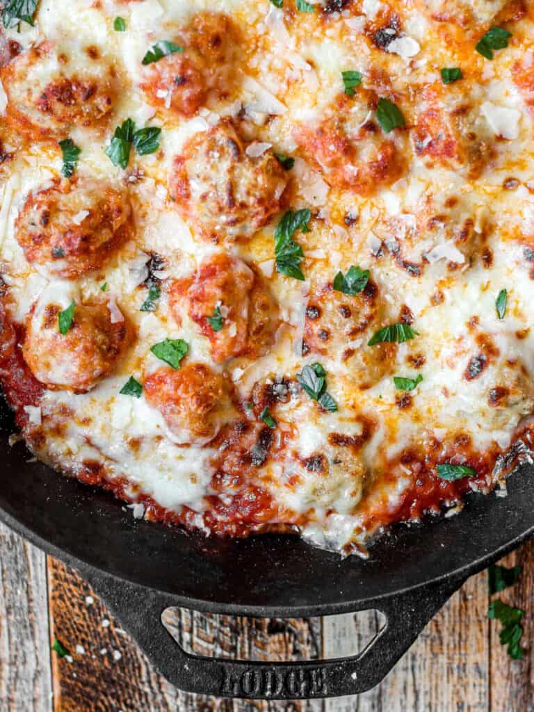 overhead shot of the chicken parm meatballs in a baking dish