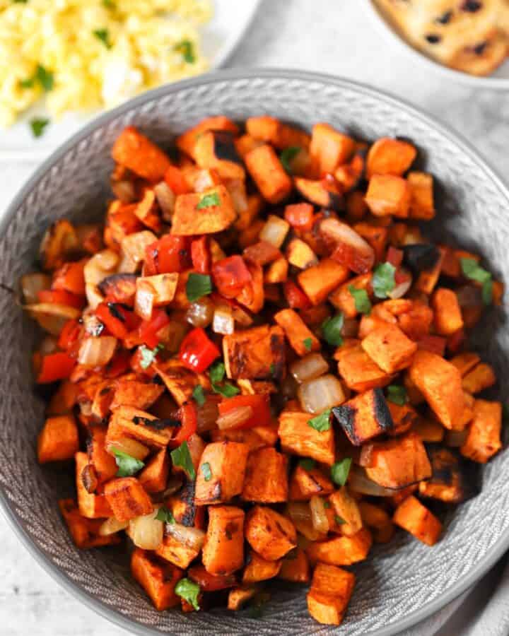 sweet potato home fries in a grey bowl