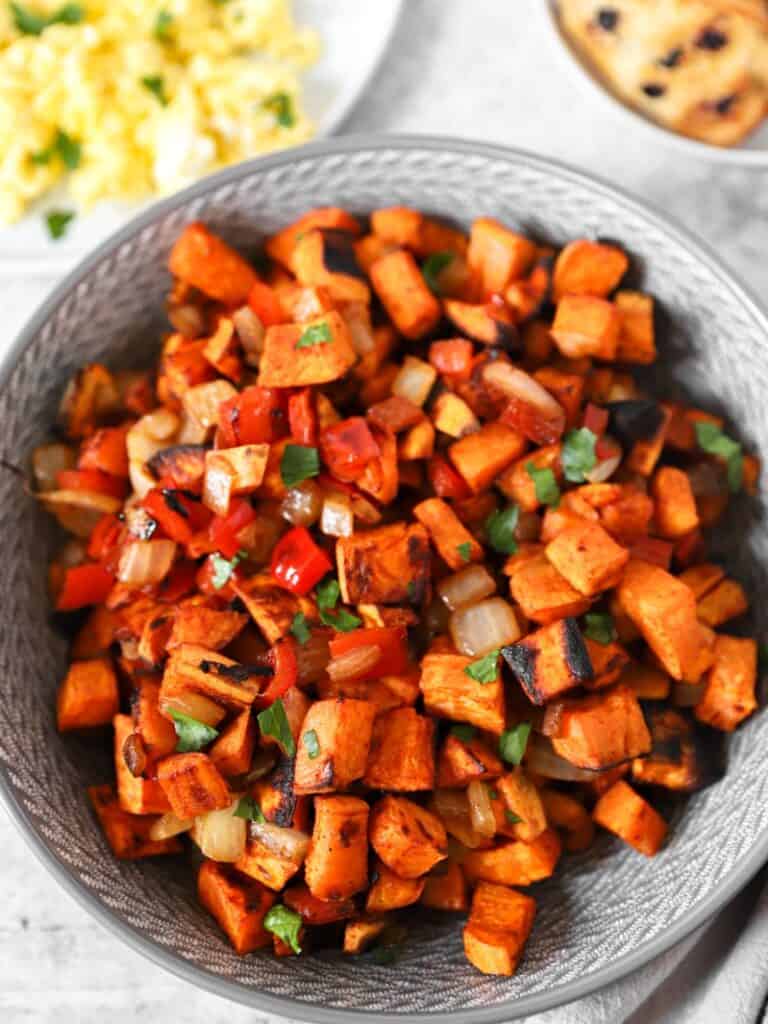 sweet potato home fries in a grey bowl