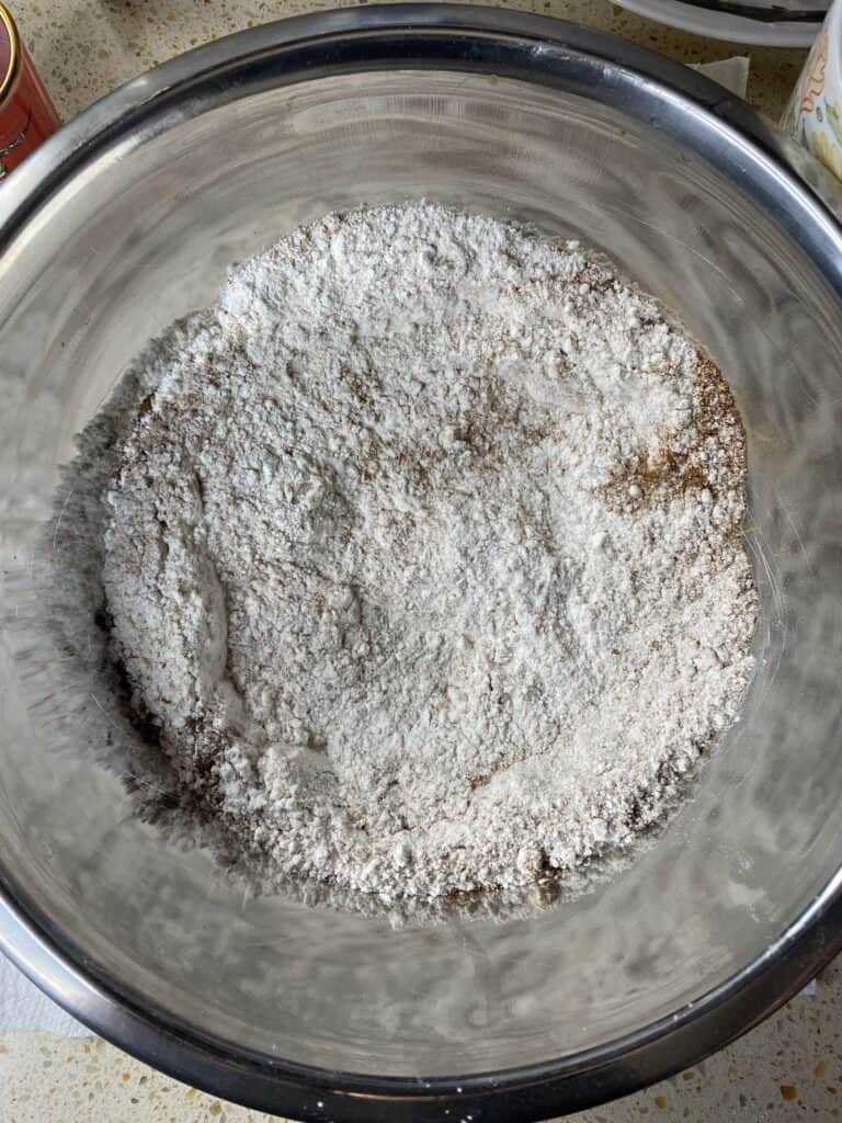 overhead shot of the dry ingredients in a silver mixing bowl