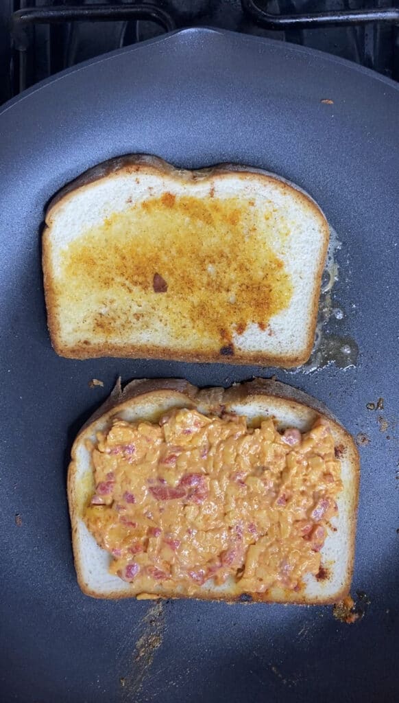 overhead shot of the grilled cheese being made in a large pan.