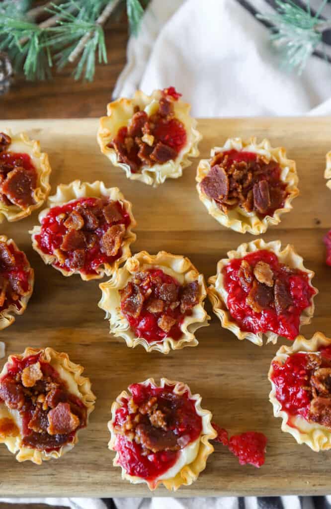 overhead photo of the brie bites on a wood cutting board.