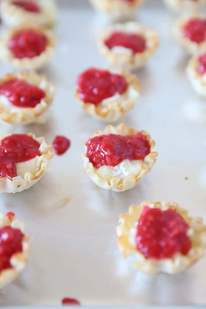 the bites now topped with raspberry sauce.