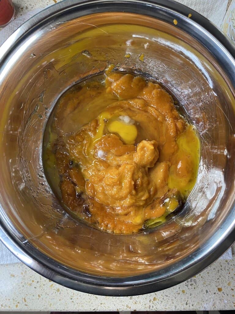 overhead shot of the wet ingredients in a silver mixing bowl