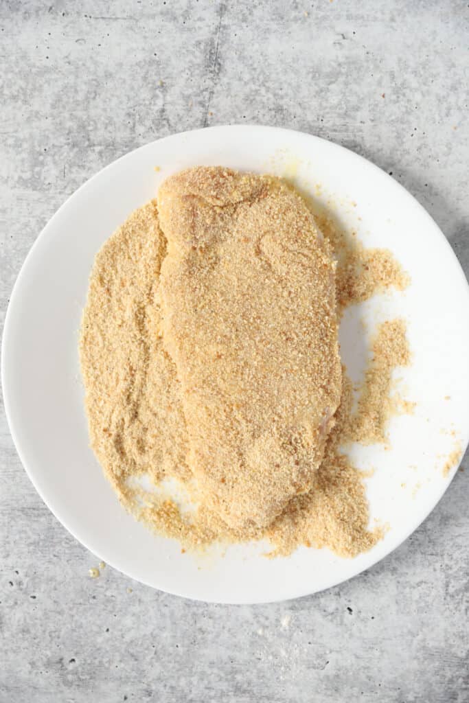 overhead shot of the chicken coated in the breadcrumbs.