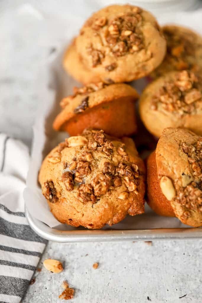 a pile of the muffins on a silver tray.