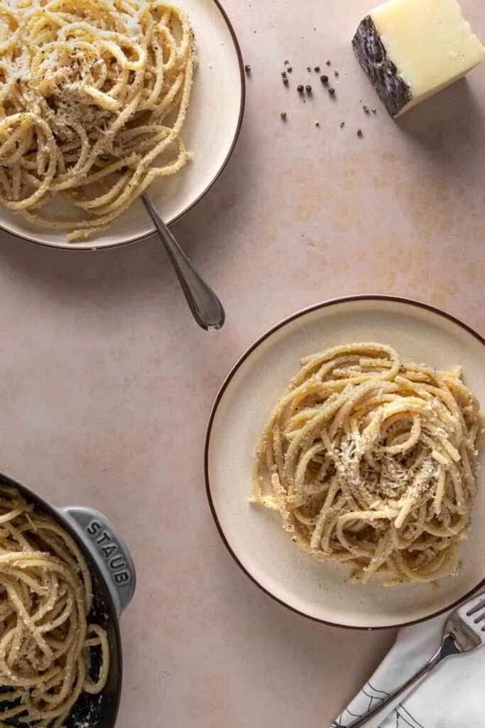 over head shot of plates of cacio e pepe pasta