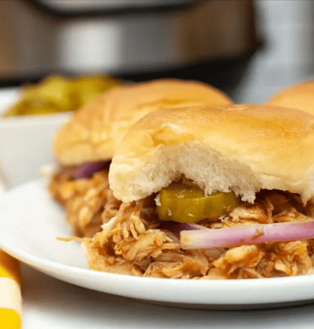 BBQ sliders on a white round plate