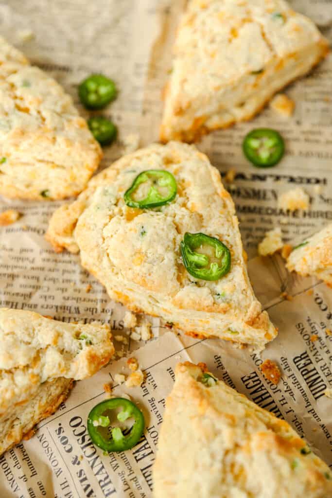 Jalapeño Cheddar Scones on brown newsprint paper.