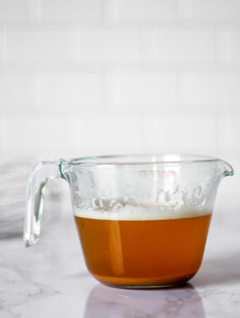 brown butter in a glass measuring cup.