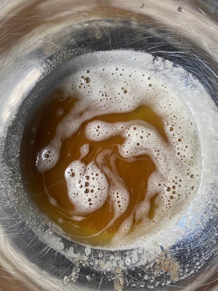 overhead photo of the brown butter in a stainless steel bowl