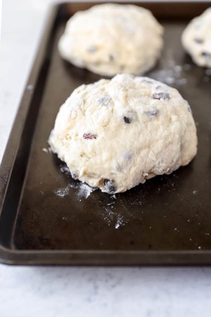 the unbaked bread loaf on the baking sheet.