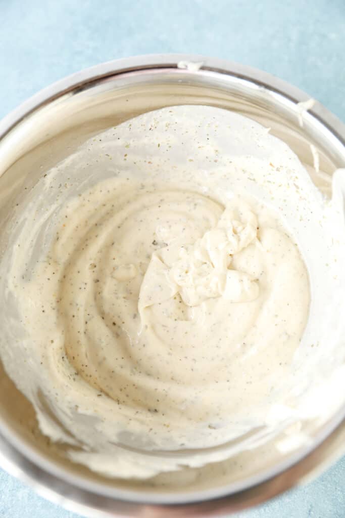 overhead photo of the mayo dressing in a silver bowl.