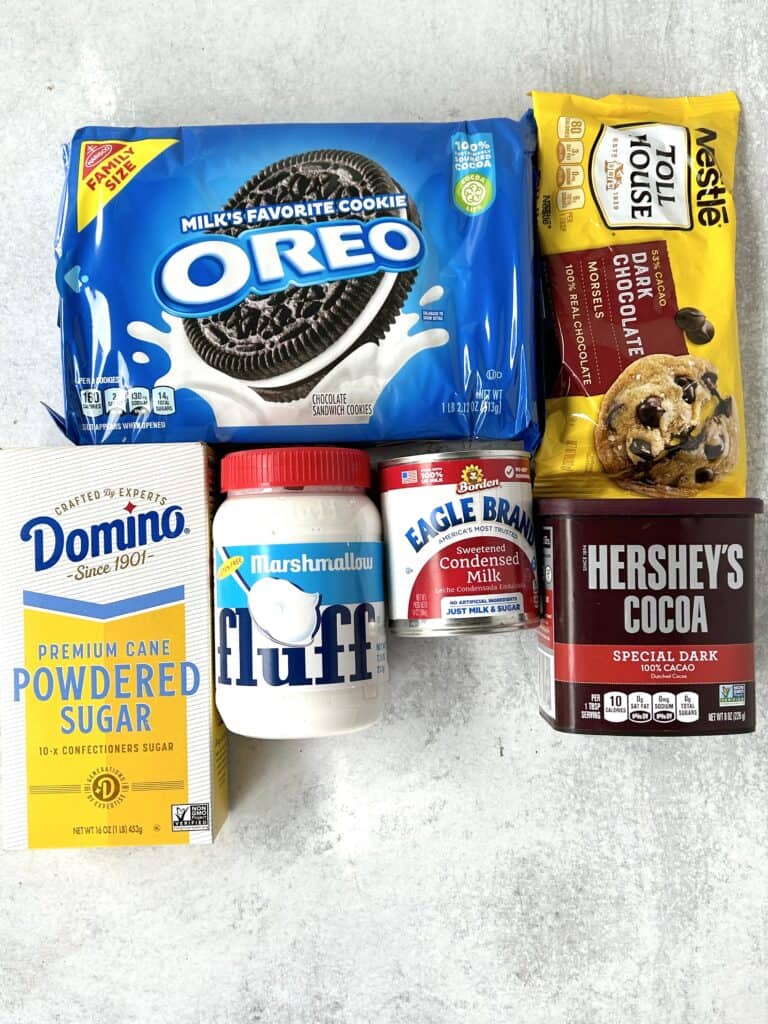 overhad photo of packaged ingredients: Oreos, dark chocolate morsels, powdered sugar, marshmallow fluff, sweetened condensed milk, special dark cocoa powder.