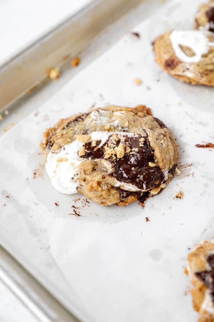 s'mores cookies on a parchment paper lined baking sheet