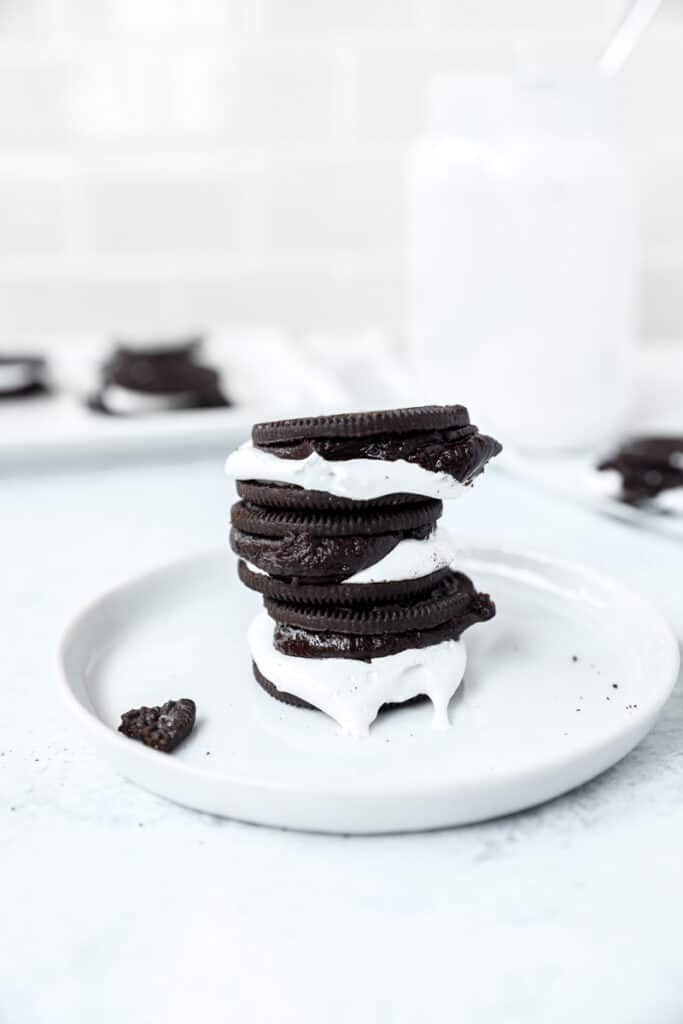 stack of 3 oreo s'mores on a round white plate.