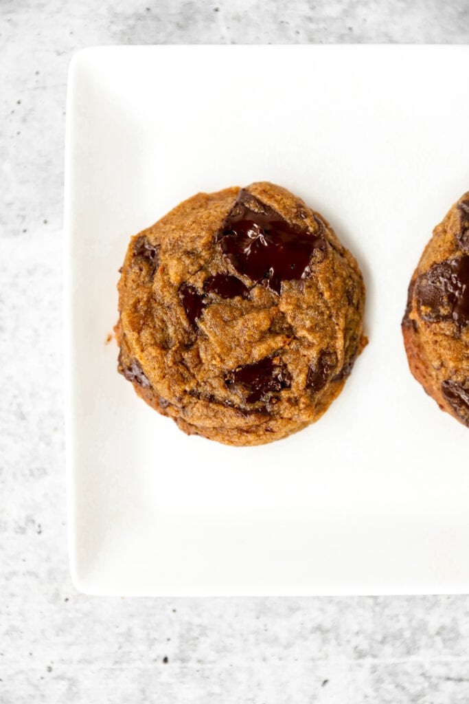 overhead photo of the baked cookie on a white plate.