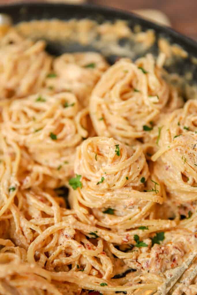 spirals of marry me pasta in a dark non-stick pan