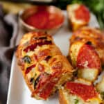 pepperoni stuffed garlic bread on a white platter