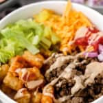 burger bowls in a white bowl topped with the special burger sauce.
