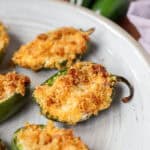 Baked Jalapeño Poppers on a grey round plate