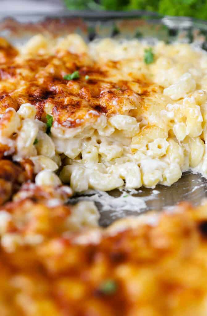 showing the inside of the mac and cheese still in the glass casserole dish.