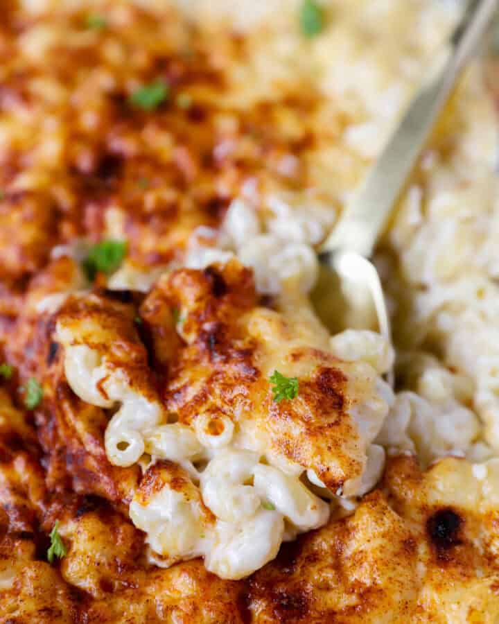 a gold spoon serving the gouda mac and cheese