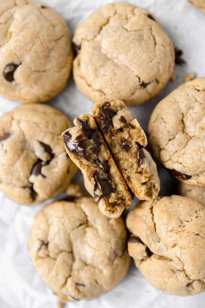 overhead photo of the banana peanut butter cookies with one split in half to show the interior texture.