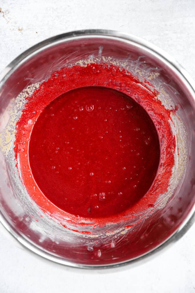 overhead photo of the red wet ingredients in a stainless steel bowl.