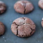 chocolate espresso snickerdoodles on a baking sheet.