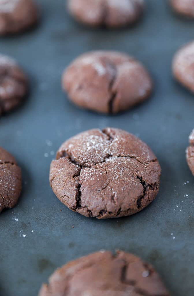 chocolate espresso snickerdoodles on a baking sheet.