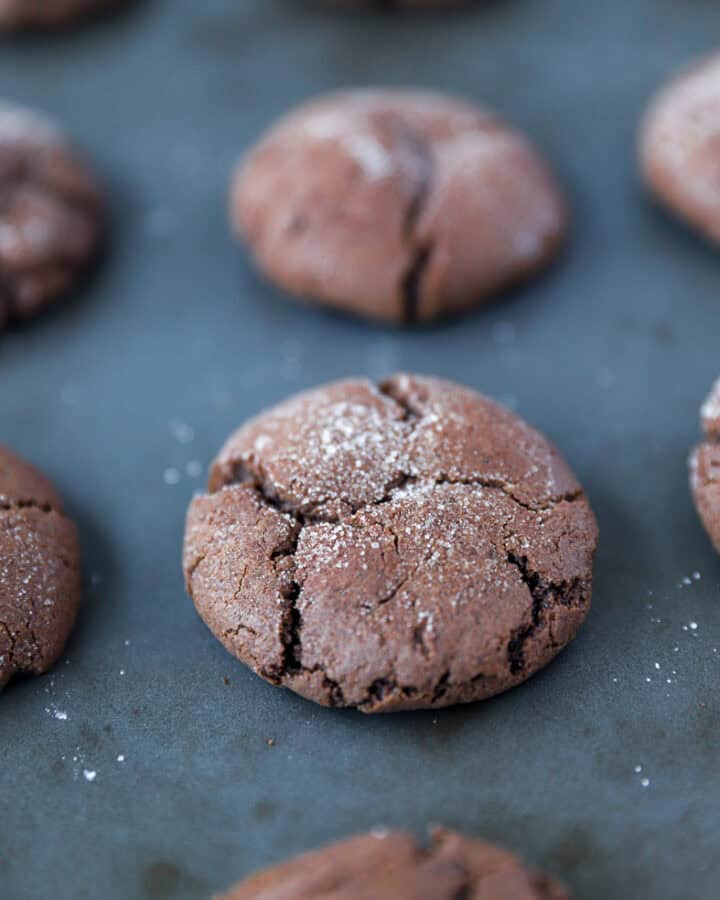 chocolate espresso snickerdoodles on a baking sheet.