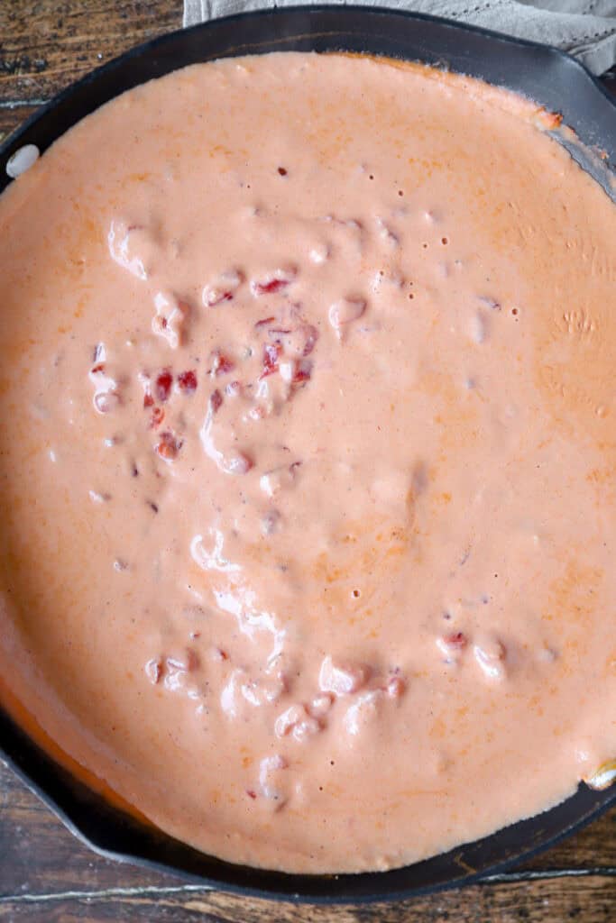overhead photo of the tomato sauce in a nonstick pan.