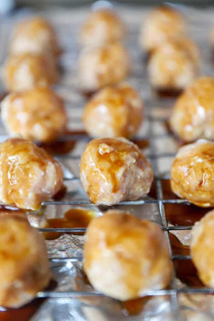 the uncooked meatballs now drizzled with some of the teriyaki sauce.